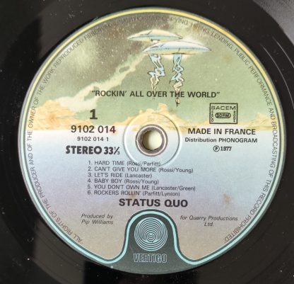 label vinyle 33tours artiste status quo titre rockin' all over the world vinyle d'occasion originvinylstore montauban